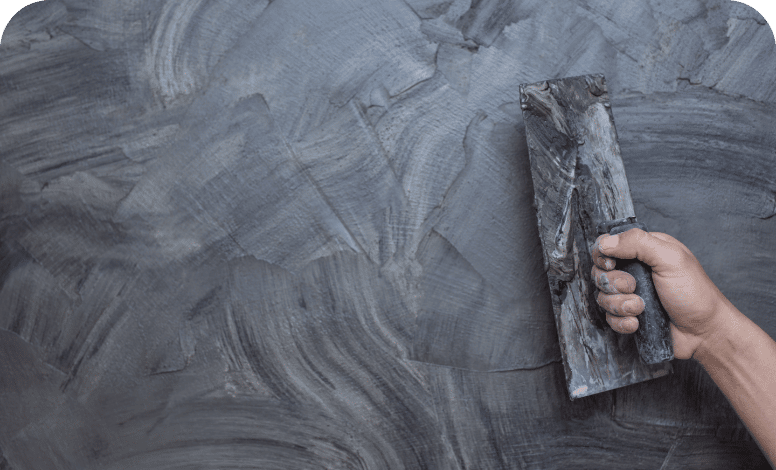 Plasterer renovating indoor walls